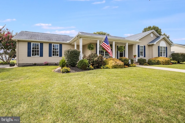 single story home featuring a front lawn