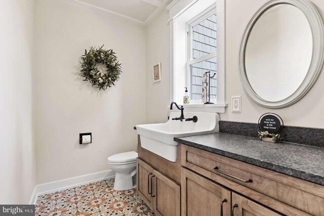 bathroom featuring crown molding, tile patterned floors, toilet, and vanity