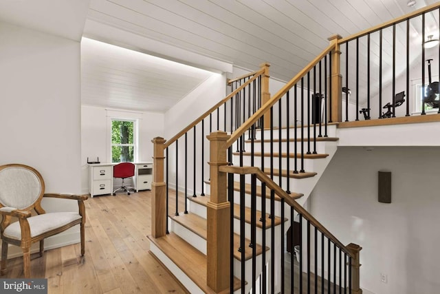 staircase featuring wood-type flooring