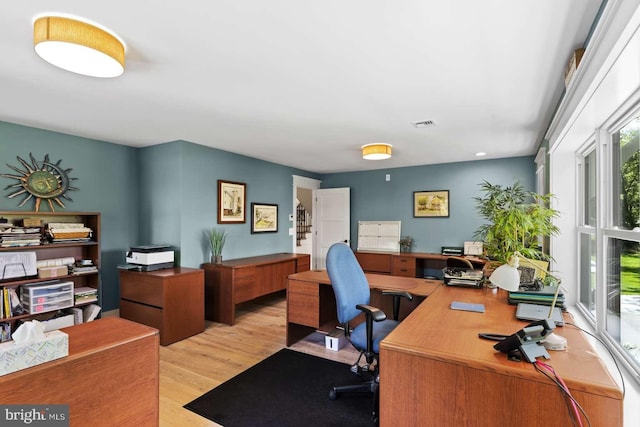 home office with light wood-type flooring