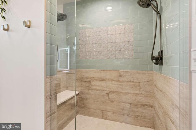 bathroom featuring an enclosed shower