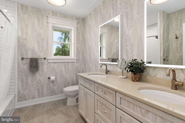 full bathroom with tile patterned flooring, toilet, shower / bathtub combination with curtain, and vanity