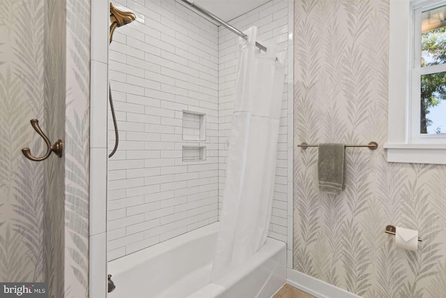 bathroom featuring shower / tub combo with curtain