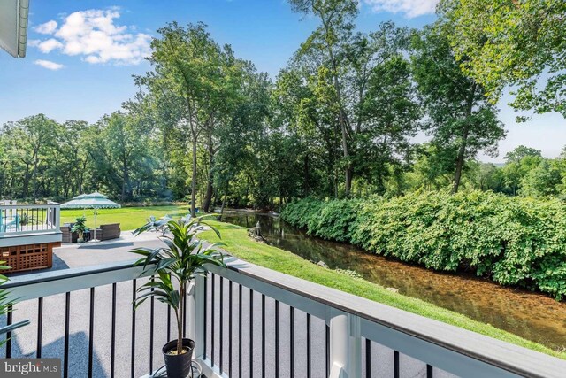 balcony featuring a water view