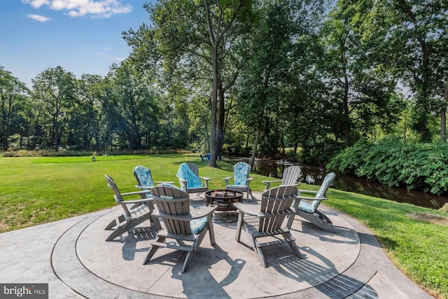 view of patio / terrace featuring an outdoor fire pit