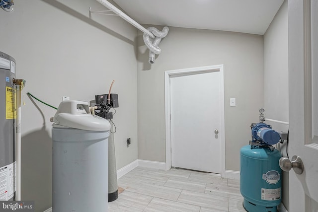 laundry room featuring gas water heater