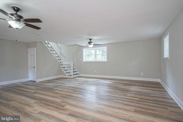 unfurnished room featuring hardwood / wood-style floors and ceiling fan