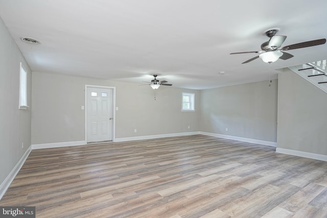 interior space with ceiling fan and light wood-type flooring