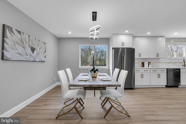 dining area with light wood-type flooring