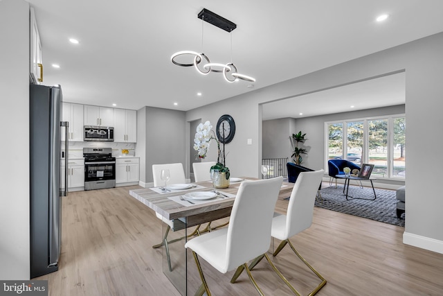 dining space featuring light hardwood / wood-style flooring