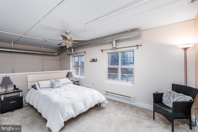 bedroom featuring a baseboard radiator and carpet