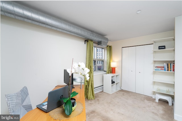 office space with carpet and baseboard heating