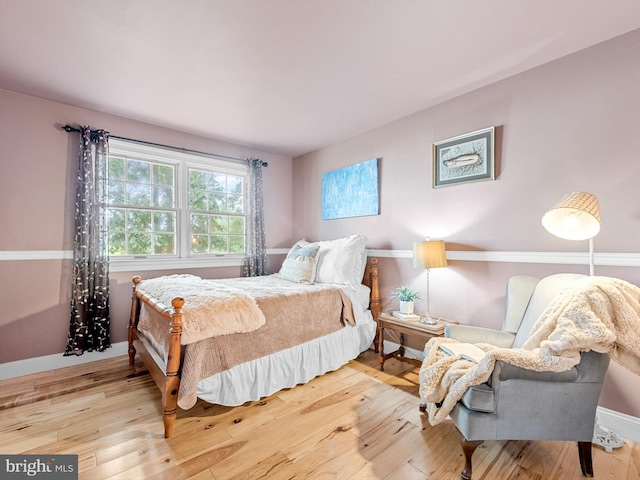 bedroom with light wood-type flooring