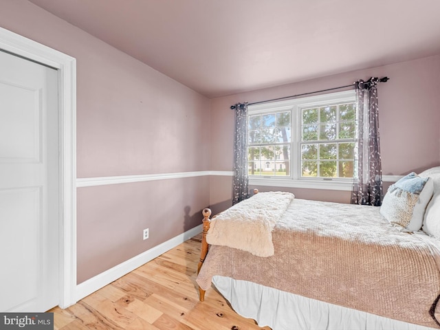 bedroom with light hardwood / wood-style flooring