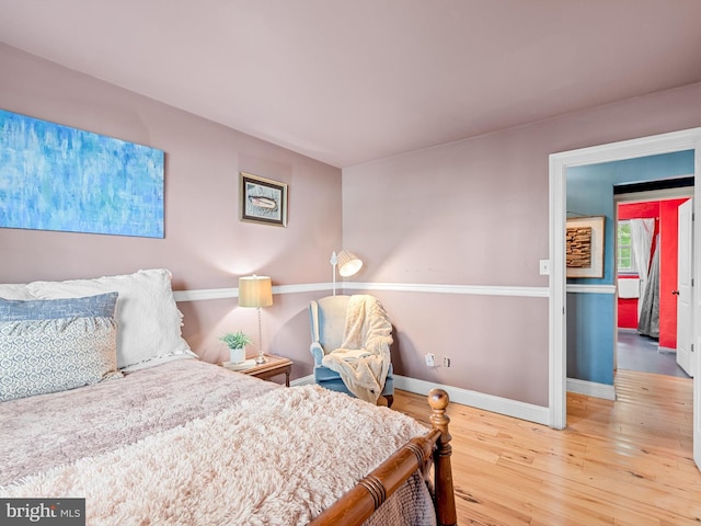 bedroom with hardwood / wood-style floors