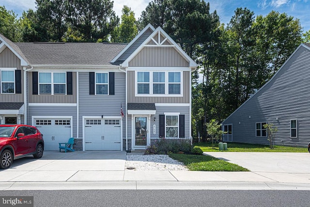 view of front of property featuring a garage and a front lawn