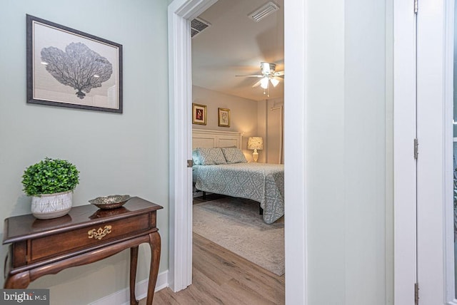 bedroom featuring ceiling fan and light hardwood / wood-style floors