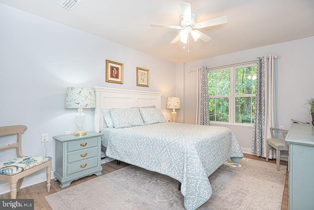 bedroom featuring ceiling fan and hardwood / wood-style flooring