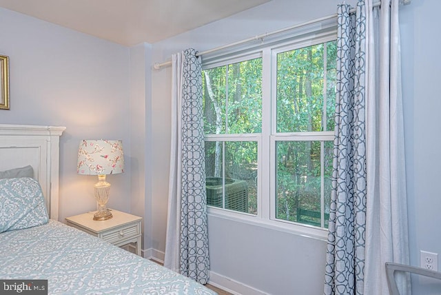 bedroom featuring multiple windows