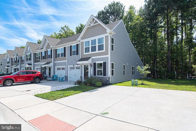 view of front of home with a front lawn and a garage