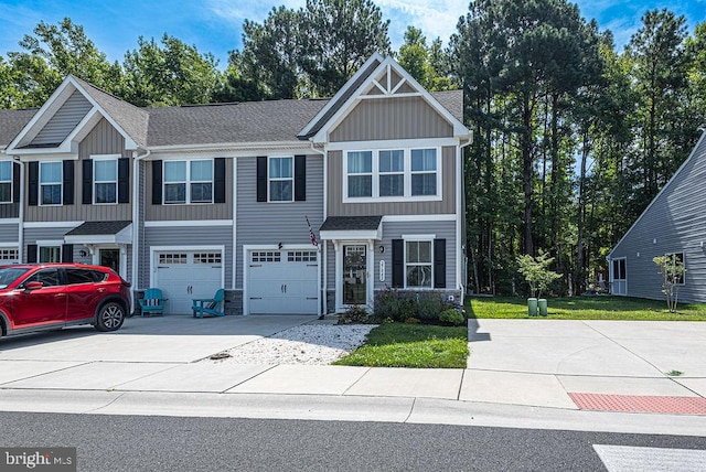 view of front of home with a garage and a front lawn