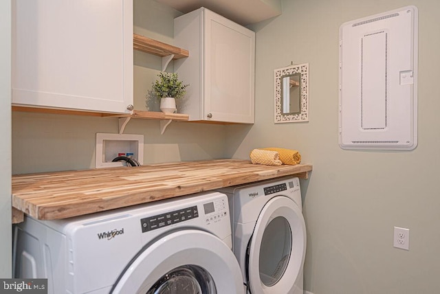 laundry room featuring cabinets and separate washer and dryer