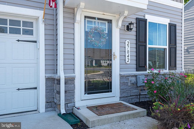 property entrance featuring a garage