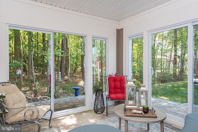 sunroom with wooden ceiling