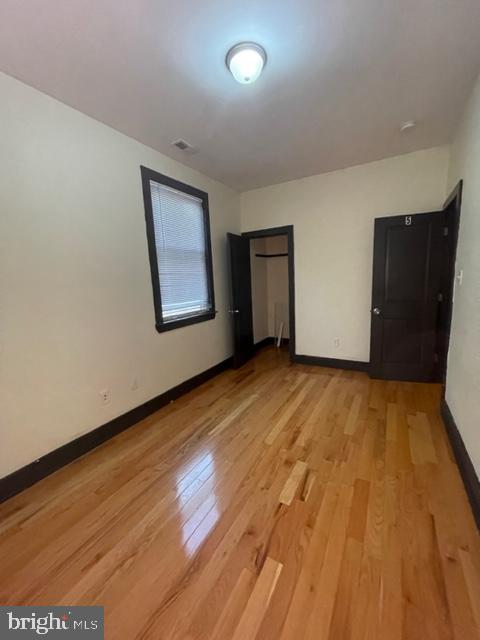 unfurnished bedroom with light hardwood / wood-style flooring