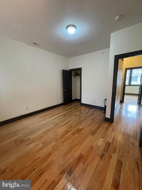 empty room featuring hardwood / wood-style floors