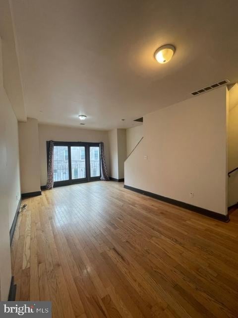 spare room featuring hardwood / wood-style floors