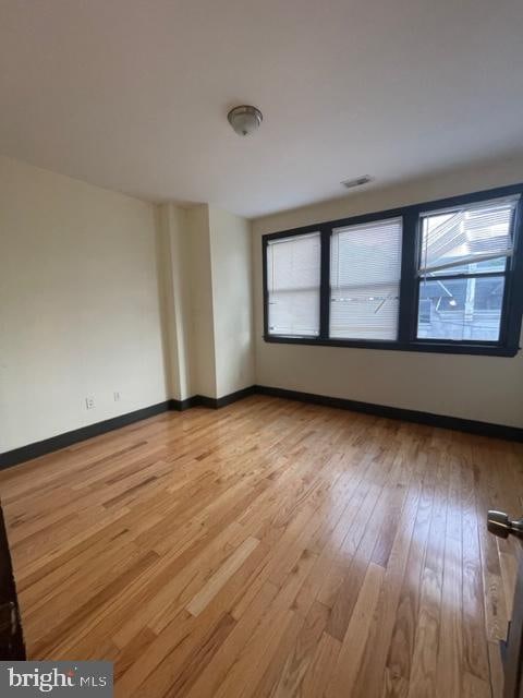 empty room featuring hardwood / wood-style flooring