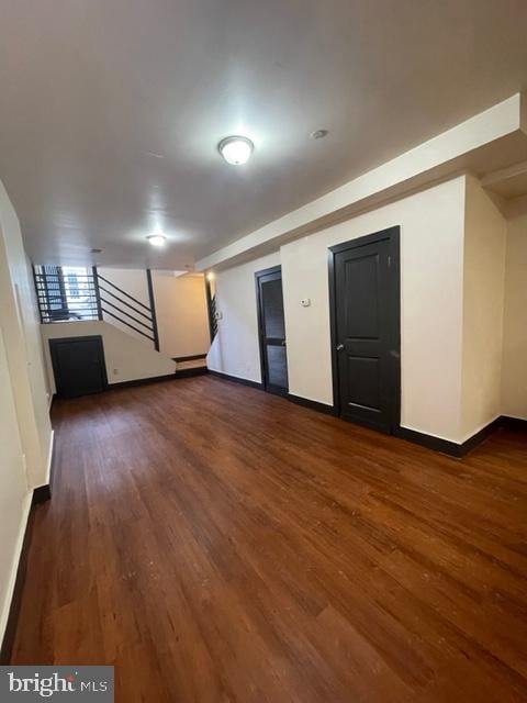 basement featuring dark wood-type flooring