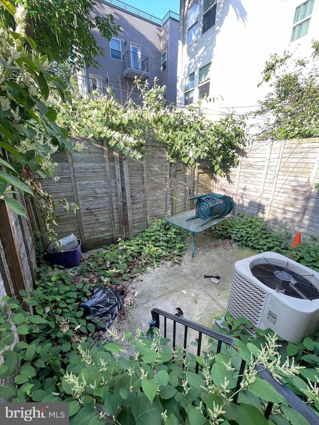 view of yard with a patio area and cooling unit