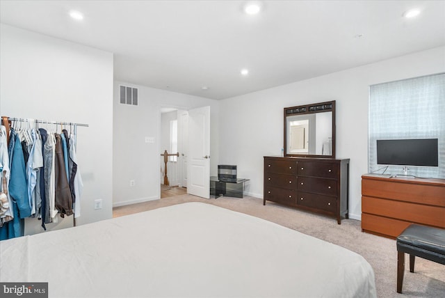 bedroom with light carpet