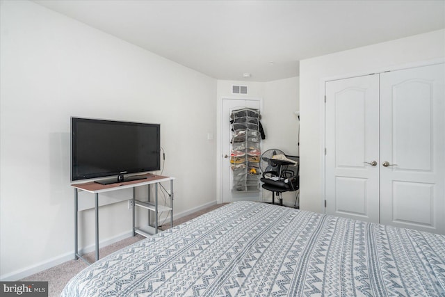 carpeted bedroom featuring a closet