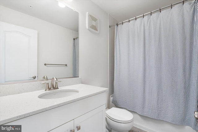 full bathroom with vanity, shower / tub combo with curtain, and toilet