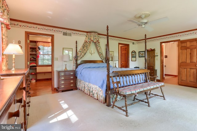 bedroom featuring light carpet, baseboards, visible vents, and crown molding