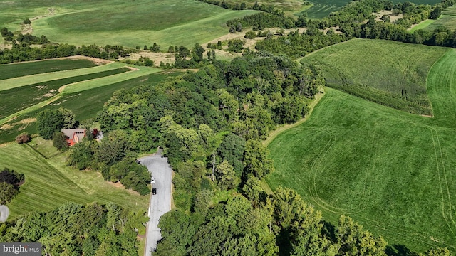 birds eye view of property with a rural view