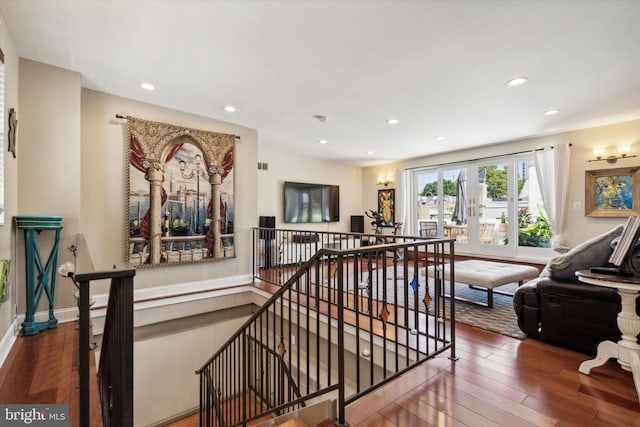 interior space with wood-type flooring and french doors