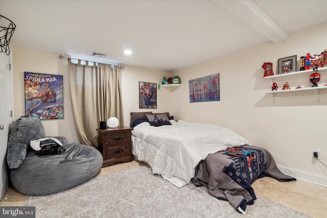 tiled bedroom featuring beamed ceiling