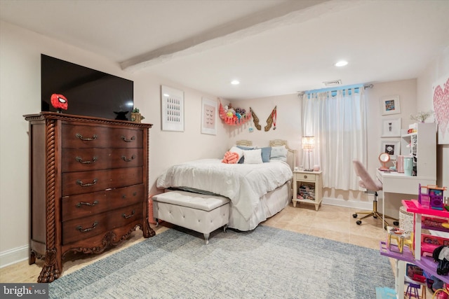 tiled bedroom featuring beamed ceiling