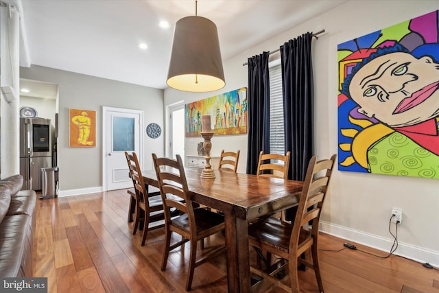 dining area featuring wood-type flooring