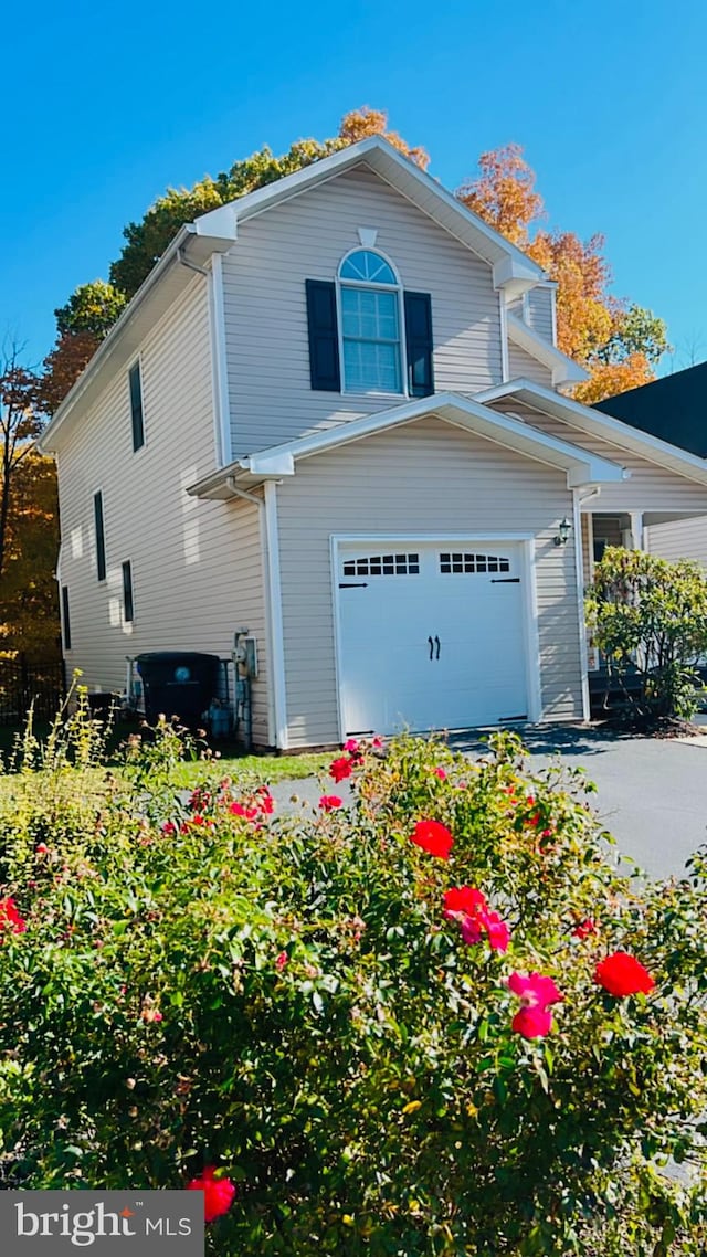 view of side of property with a garage