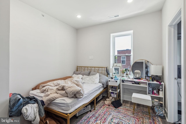 bedroom featuring wood-type flooring