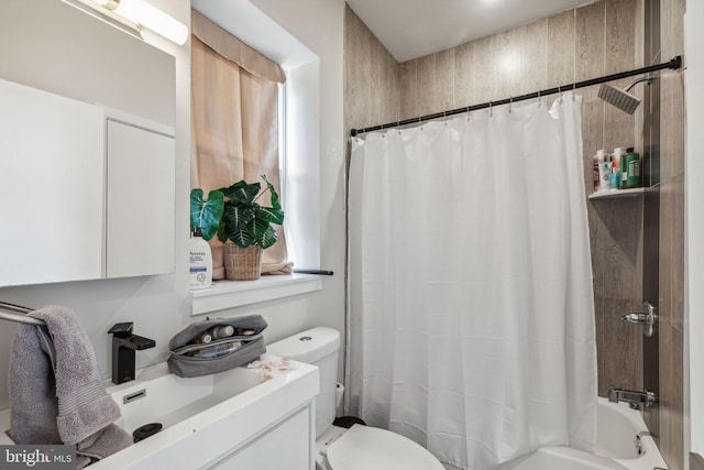 full bathroom featuring vanity, shower / bath combo, and toilet