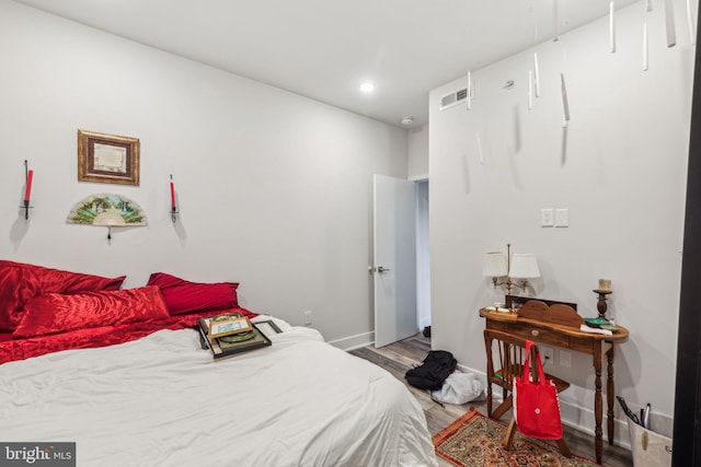 bedroom with light wood-type flooring