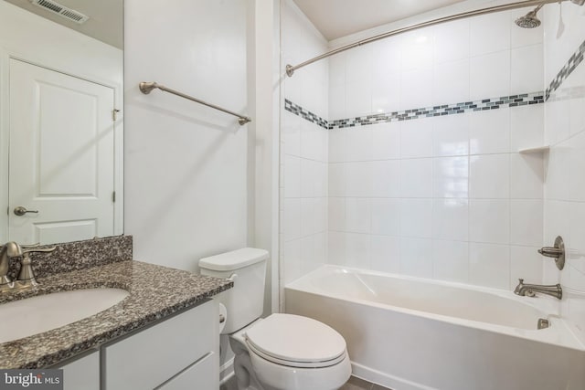 bathroom with shower / washtub combination, visible vents, vanity, and toilet