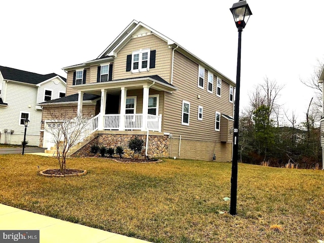 view of front of property with a porch and a front yard