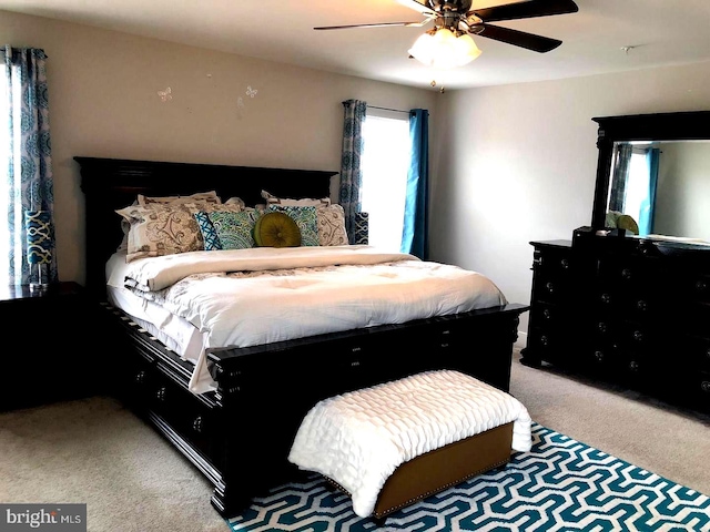 bedroom with ceiling fan and carpet floors